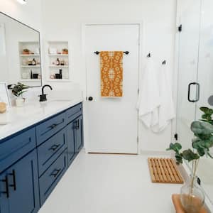 white bathroom with blue vanity